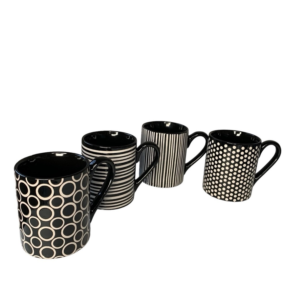 Food Network black and white multi patterned‎ coffee mugs. 4” height.